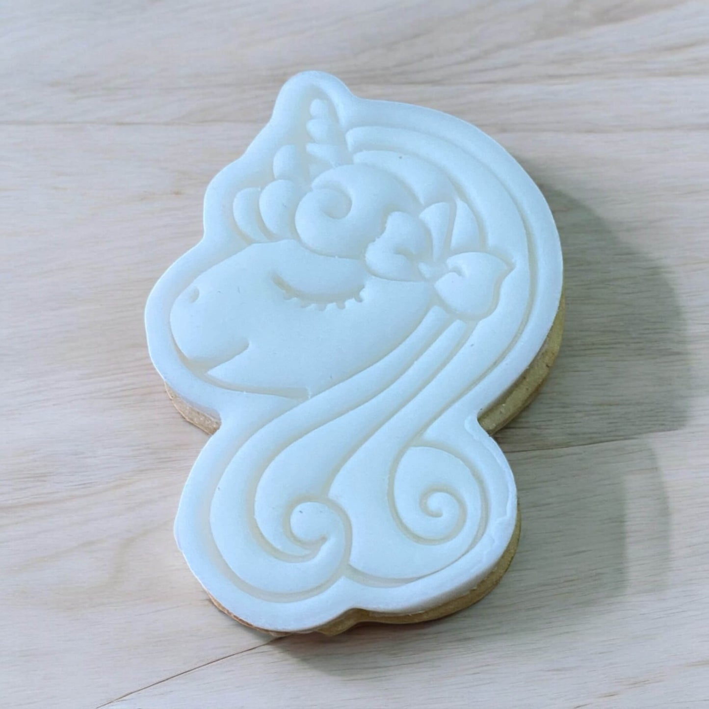 Unicorn Head Paint Your Own Cookie – unicorn head-shaped iced biscuit with edible paint palette and brush, magical and creative kids’ baking activity or party treat.