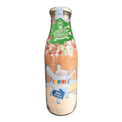 A glass bottle filled with Funfetti Christmas Sandwich Mix, featuring a green 'Merry Christmas' label and a blue and white Funfetti logo on the front, set against a plain white background.