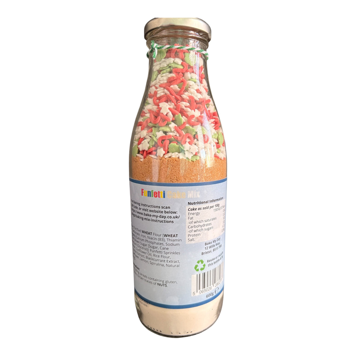A glass bottle of Farneti Turrial flour, showing the back label and the colorful textured flour inside, set against a plain white background.