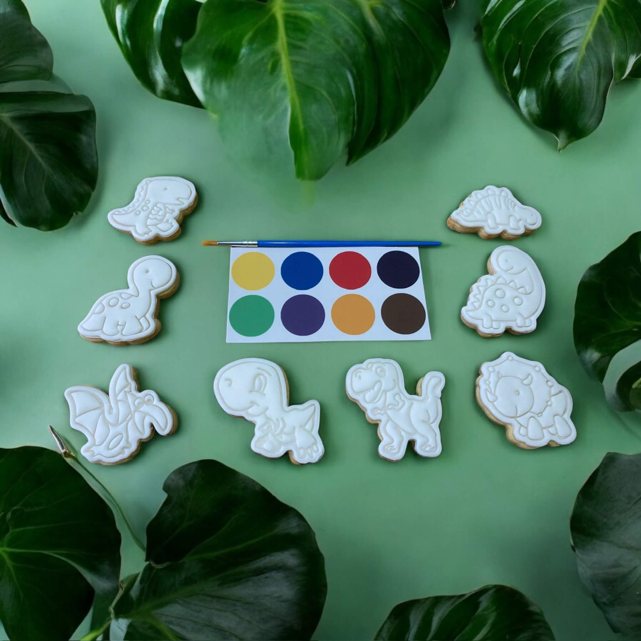 Dinosaur Paint Your Own Cookies Set with iced dinosaur-shaped biscuits, edible paint palette and brush – fun kids’ baking activity for birthdays, parties and creative treats.