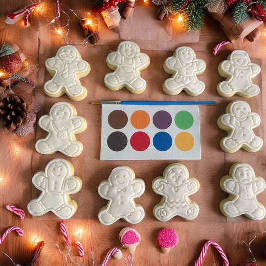 Gingerbread Men Paint Your Own Cookie Set – gingerbread-shaped iced biscuits with edible paint palette and brush, fun and creative kids’ baking activity or party treat.