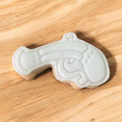 Pirate Gun Paint Your Own Cookie – gun-shaped iced biscuit with edible paint palette and brush, fun and creative kids’ baking activity or pirate-themed party treat.