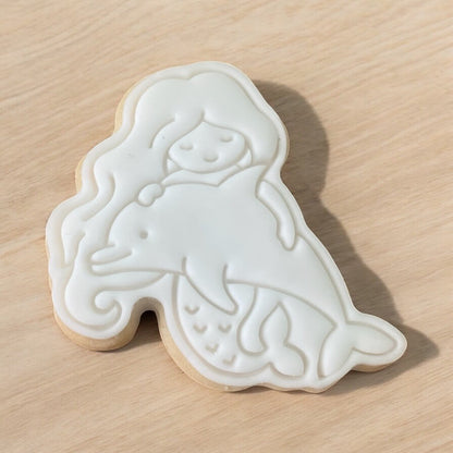 Mermaid with Dolphin Paint Your Own Cookie – mermaid and dolphin-shaped iced biscuit with edible paint palette and brush, creative kids’ baking activity or mermaid-themed party treat.