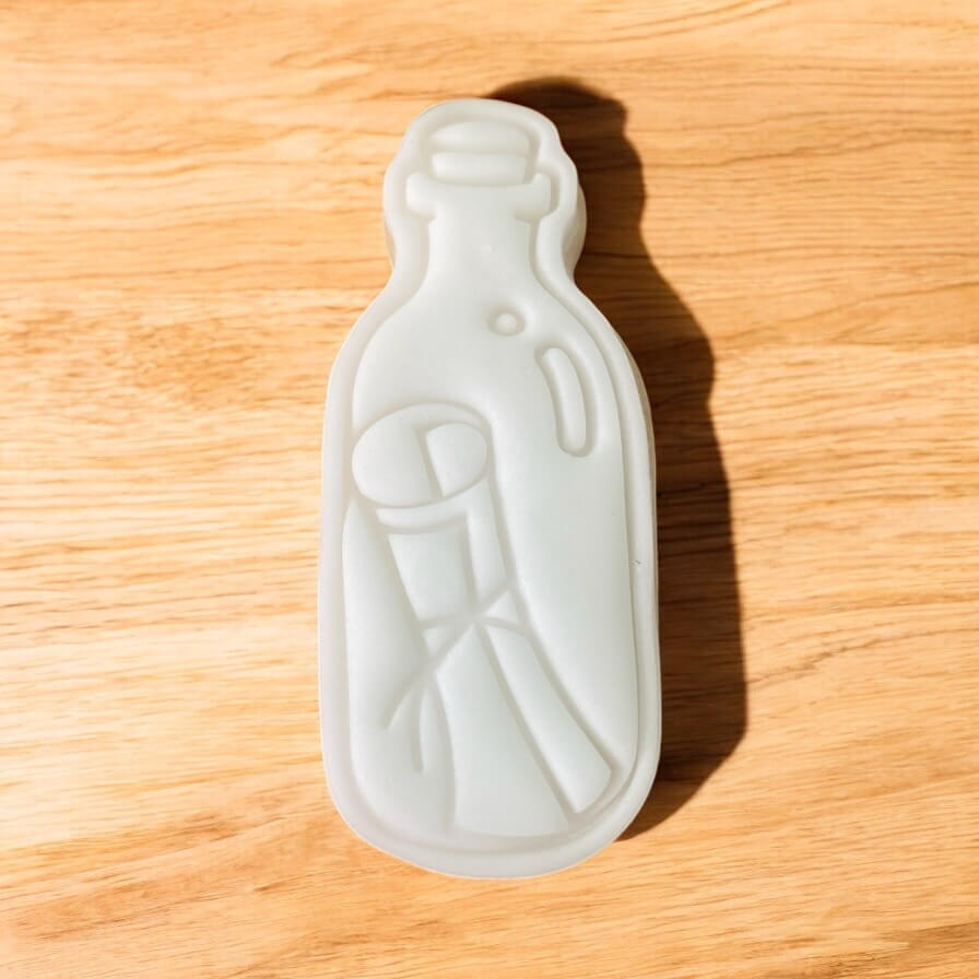 Message Bottle Paint Your Own Cookie – bottle-shaped iced biscuit with edible paint palette and brush, creative kids’ baking activity or pirate-themed party treat.