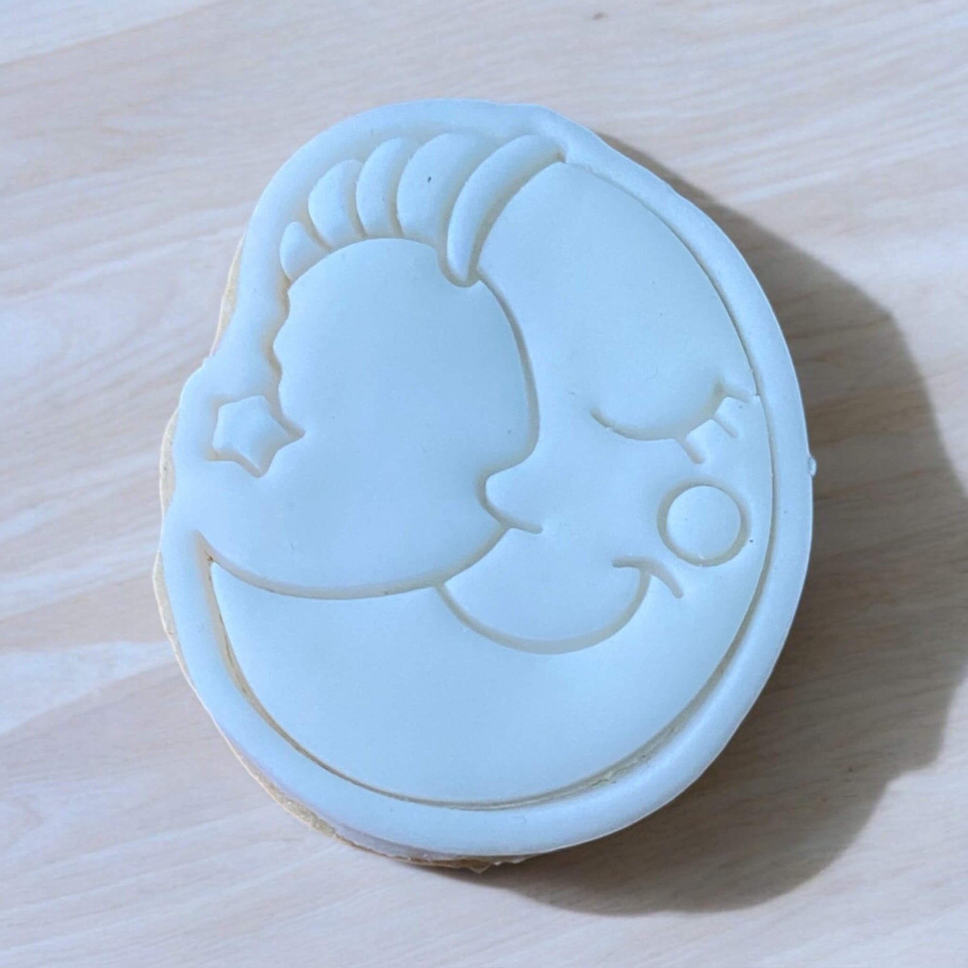 Moon Paint Your Own Cookie – crescent moon-shaped iced biscuit with edible paint palette and brush, creative kids’ baking activity or space-themed party treat.