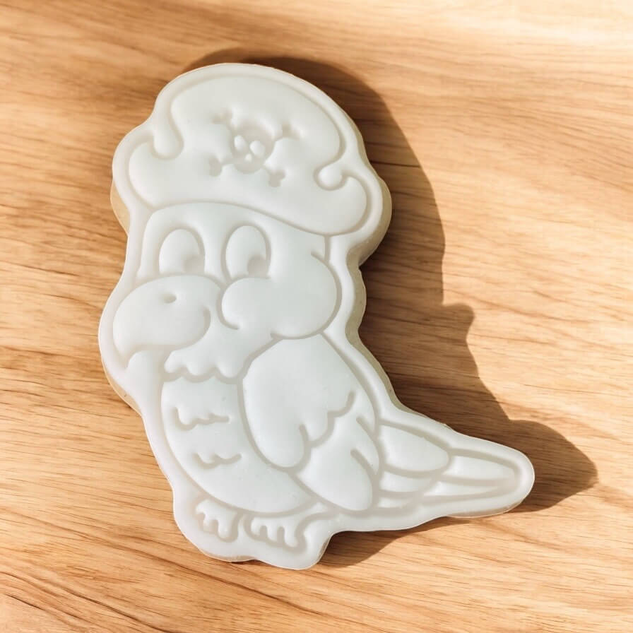 Parrot Paint Your Own Cookie – parrot-shaped iced biscuit with edible paint palette and brush, fun and creative kids’ baking activity or pirate-themed party treat.