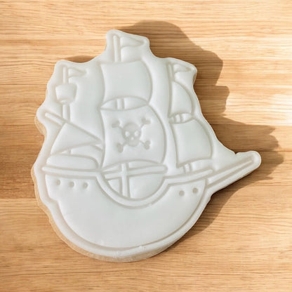Pirate Ship Paint Your Own Cookie – ship-shaped iced biscuit with edible paint palette and brush, fun and creative kids’ baking activity or pirate-themed party treat.