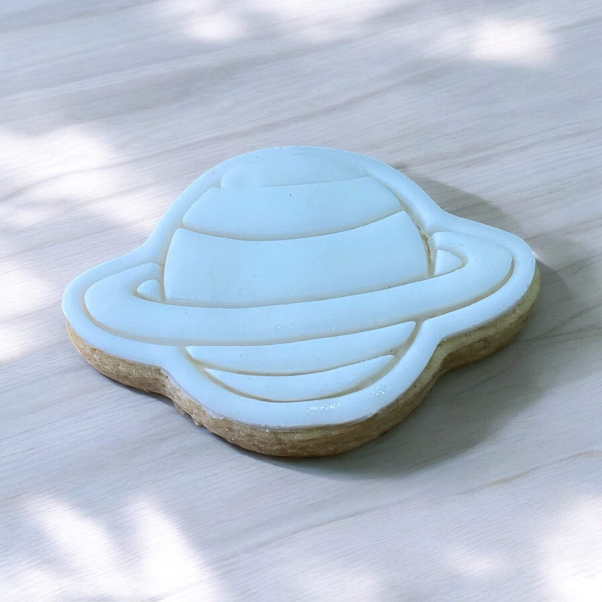 Planet Paint Your Own Cookie – planet-shaped iced biscuit with edible paint palette and brush, fun and creative kids’ baking activity or space-themed party treat.