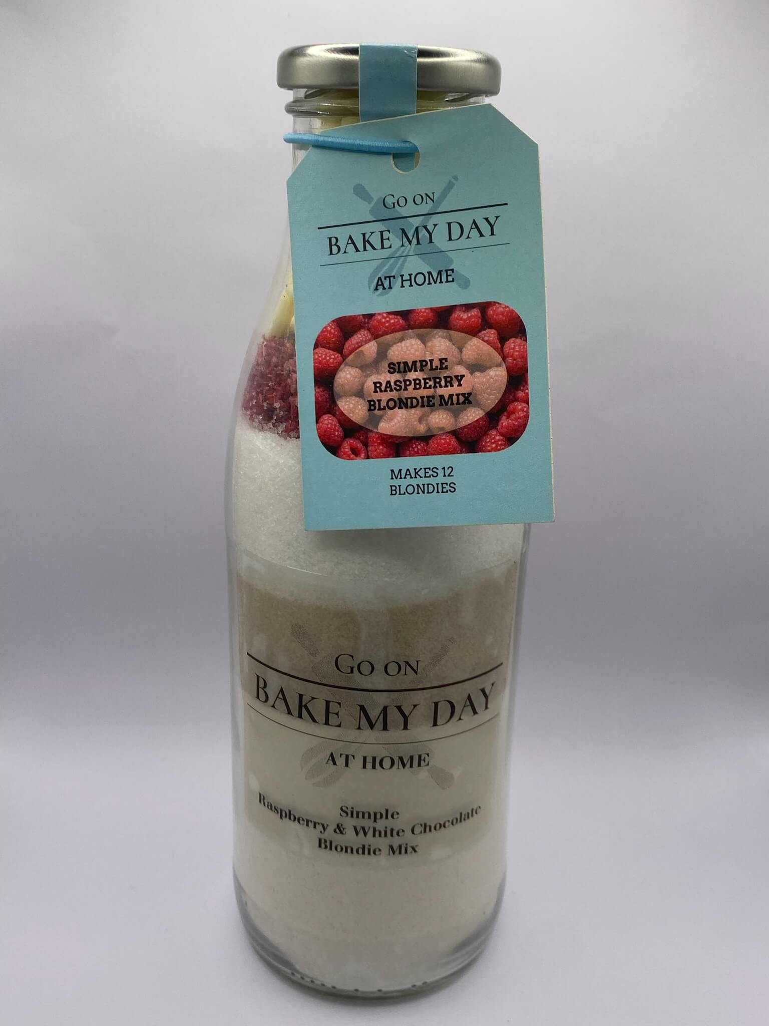 Raspberry & White Chocolate Blondie Baking Mix Bottle – bake-at-home jar kit UK with pre-measured ingredients to make 12 soft, chewy homemade Raspberry & White Chocolate blondies in a 9” x 9” tray
