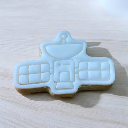 Spaceship Paint Your Own Cookie – rocket ship-shaped iced biscuit with edible paint palette and brush, fun and creative kids’ baking activity or space party treat.