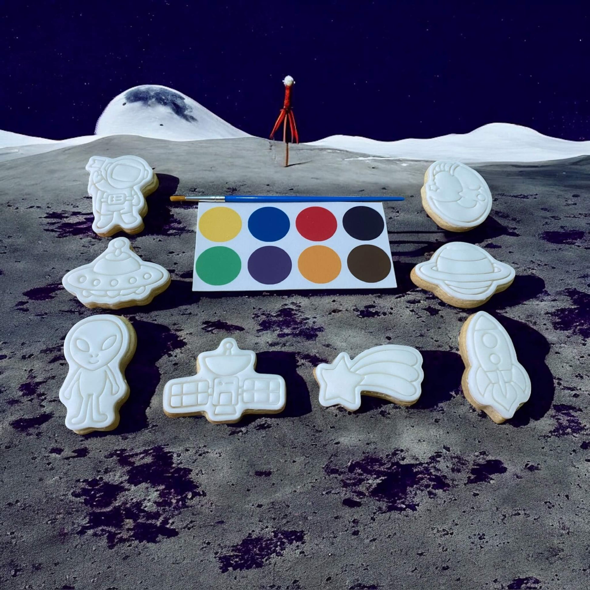 Space Paint Your Own Cookie Set – galaxy and space-themed iced biscuits with edible paint palette and brush, fun and creative kids’ baking activity or party treat.