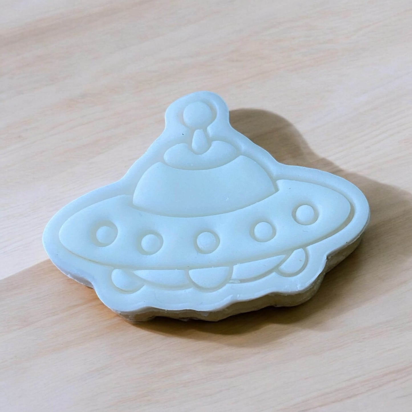Spaceship Paint Your Own Cookie – rocket ship-shaped iced biscuit with edible paint palette and brush, fun and creative kids’ baking activity or space party treat.