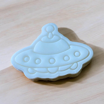Spaceship Paint Your Own Cookie – rocket ship-shaped iced biscuit with edible paint palette and brush, fun and creative kids’ baking activity or space party treat.