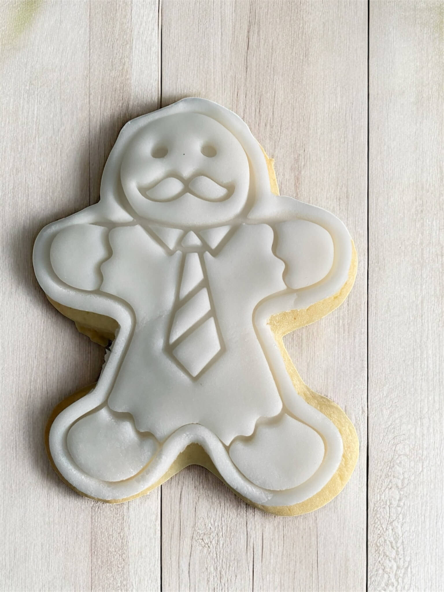 Business Man Paint Your Own Cookie – gingerbread man-shaped iced biscuit in business attire with edible paint palette and brush, creative kids’ baking activity or holiday party treat.