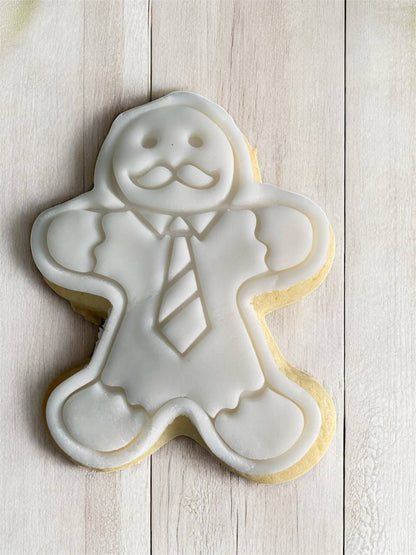Business Man Paint Your Own Cookie – gingerbread man-shaped iced biscuit in business attire with edible paint palette and brush, creative kids’ baking activity or holiday party treat.