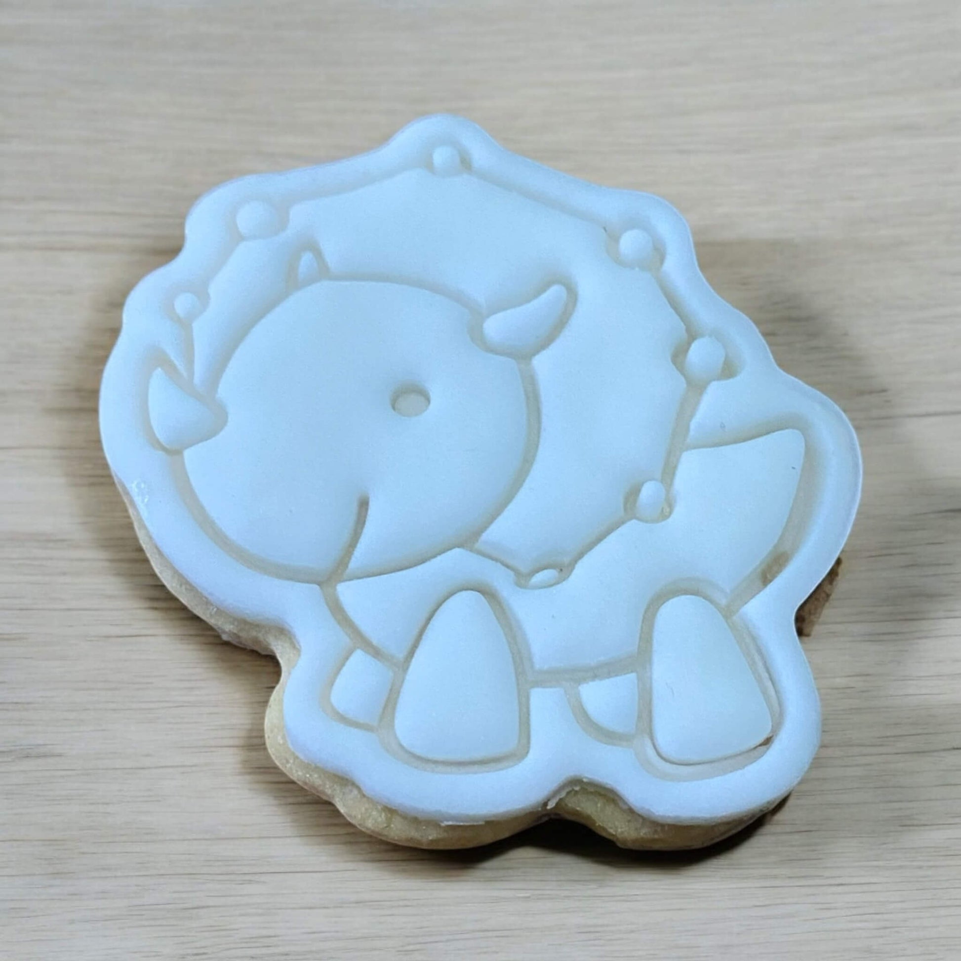 Triceratops Paint Your Own Cookie – three-horned dinosaur shaped iced biscuit with edible paint palette and brush, fun and creative kids’ baking activity or party treat.