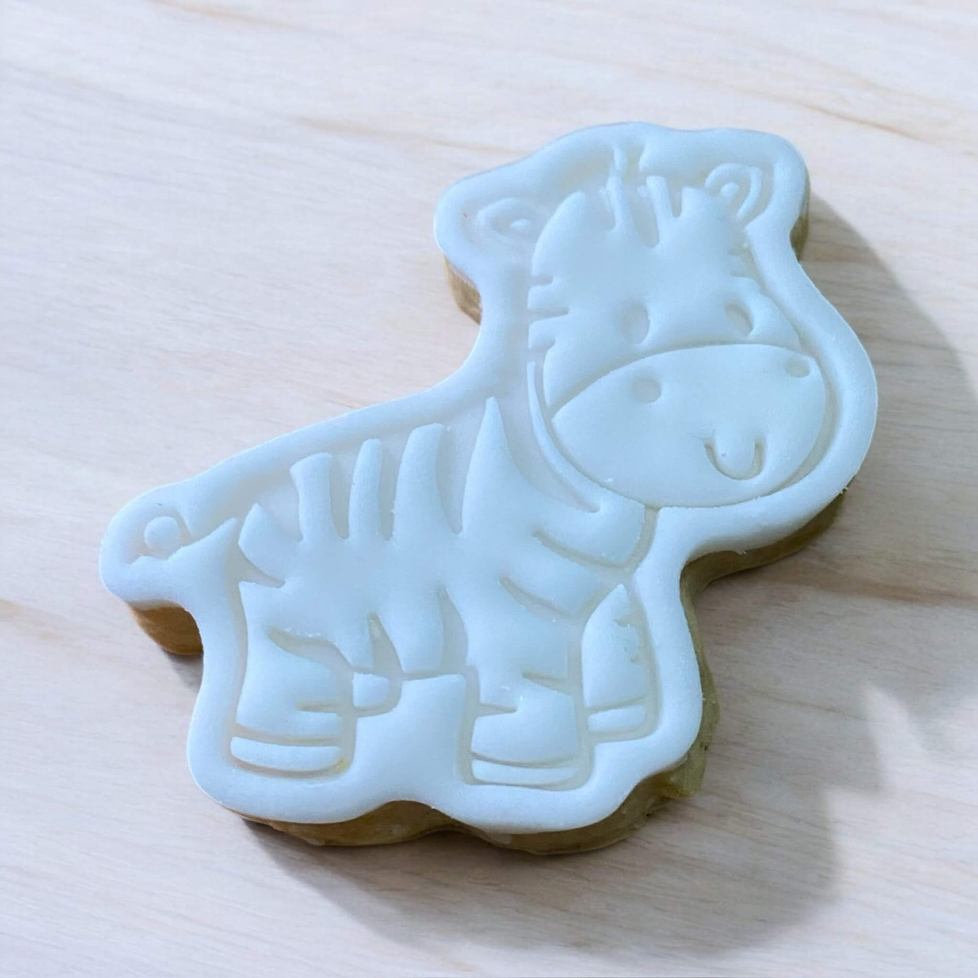 Zebra Paint Your Own Cookie – striped zebra-shaped iced biscuit with edible paint palette and brush, fun and creative kids’ baking activity or party treat.